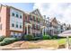 Attractive brick townhome with multiple levels, decorative shutters, and well-maintained landscaping at 2145 Shoop Se Ct # 3, Smyrna, GA 30080