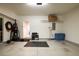 Well-lit garage featuring work-out equipment, storage racks and a charging station at 2145 Shoop Se Ct # 3, Smyrna, GA 30080