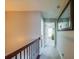 Hallway with neutral wall paint, carpet flooring and an ornate wrought iron railing at 2145 Shoop Se Ct # 3, Smyrna, GA 30080