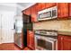 Well-equipped kitchen featuring stainless steel appliances, granite countertops, and modern cabinetry at 2145 Shoop Se Ct # 3, Smyrna, GA 30080