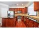 Spacious kitchen with granite countertops, stainless appliances, and rich wood cabinetry at 2145 Shoop Se Ct # 3, Smyrna, GA 30080