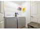 Laundry room featuring a white washer and dryer and a woven basket at 2145 Shoop Se Ct # 3, Smyrna, GA 30080