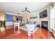Bright living room with hardwood floors, a cozy fireplace, and seamless flow to the dining area at 2145 Shoop Se Ct # 3, Smyrna, GA 30080