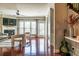 Bright living room with a fireplace, ceiling fan, and large windows, and rich hardwood floors at 2145 Shoop Se Ct # 3, Smyrna, GA 30080