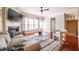 Comfortable living room with hardwood floors, a fireplace, and large windows offering plenty of light at 2145 Shoop Se Ct # 3, Smyrna, GA 30080