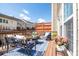 Outdoor patio with seating, potted plants, and a view of the neighborhood townhomes at 2145 Shoop Se Ct # 3, Smyrna, GA 30080