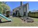 A fenced yard with a play structure and covered patio at 2477 Lakebrooke Dr, Marietta, GA 30066