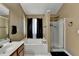 Bathroom featuring a soaking tub, walk-in shower, and elegant fixtures at 2477 Lakebrooke Dr, Marietta, GA 30066