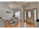 Inviting foyer with hardwood floors, stylish decor, and lots of natural light at 2477 Lakebrooke Dr, Marietta, GA 30066