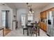 Bright kitchen with stainless steel appliances, a breakfast nook, and white marble flooring at 2477 Lakebrooke Dr, Marietta, GA 30066