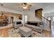 Comfortable living room with hardwood floors, open to kitchen, and staircase access at 2477 Lakebrooke Dr, Marietta, GA 30066