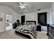 Spacious main bedroom with high ceilings and black-and-white bedding and decor at 2477 Lakebrooke Dr, Marietta, GA 30066
