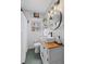 Cozy bathroom with a vessel sink, stylish lighting, and tiled walls at 542 Goldsboro Ne Rd # C, Atlanta, GA 30307