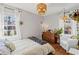 Bright bedroom with hardwood floors, natural light, and a comfortable seating area at 542 Goldsboro Ne Rd # C, Atlanta, GA 30307