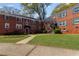 Exterior view of brick apartment buildings with well-manicured lawns and landscaping at 542 Goldsboro Ne Rd # C, Atlanta, GA 30307