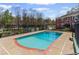 Sparkling community pool with lounge area and mature landscaping, perfect for relaxing and enjoying the outdoors at 542 Goldsboro Ne Rd # C, Atlanta, GA 30307