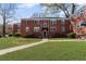 Charming red brick building with well-manicured lawn and vibrant azalea bushes at 542 Goldsboro Ne Rd # C, Atlanta, GA 30307