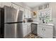 Charming kitchen with stainless steel appliances, white cabinets, and bright lighting offering a functional cooking space at 542 Goldsboro Ne Rd # C, Atlanta, GA 30307