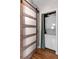 A compact laundry area with a stackable washer and dryer concealed behind a sliding door at 542 Goldsboro Ne Rd # C, Atlanta, GA 30307