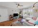 Inviting living room with large window, hardwood floors, soft lighting, and comfortable seating, creating a relaxing atmosphere at 542 Goldsboro Ne Rd # C, Atlanta, GA 30307