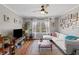 Sunlit living room with hardwood floors, comfortable seating, and natural light creating a warm and inviting living space at 542 Goldsboro Ne Rd # C, Atlanta, GA 30307