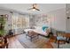 Bright living room with hardwood floors, comfortable seating, and natural light from the window, creating an inviting atmosphere at 542 Goldsboro Ne Rd # C, Atlanta, GA 30307