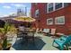 Brick patio with outdoor seating and shade umbrella, perfect for entertaining guests at 542 Goldsboro Ne Rd # C, Atlanta, GA 30307
