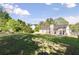 Spacious backyard with mature trees and plenty of room to enjoy at 1222 W Wylie Bridge Rd, Woodstock, GA 30188