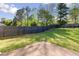 Spacious backyard with lush green grass and a privacy fence at 1222 W Wylie Bridge Rd, Woodstock, GA 30188