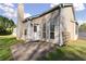 Exterior view of the house, patio, and fenced backyard at 1222 W Wylie Bridge Rd, Woodstock, GA 30188