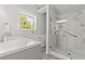 Beautiful bathroom featuring a new marble walk-in shower, modern vanity, and bright natural light at 1222 W Wylie Bridge Rd, Woodstock, GA 30188