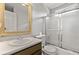 Bathroom featuring a vanity, toilet, and shower with glass doors at 1222 W Wylie Bridge Rd, Woodstock, GA 30188