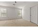 Bright bedroom featuring neutral carpet and ceiling fan at 1222 W Wylie Bridge Rd, Woodstock, GA 30188