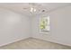 Cozy bedroom with neutral carpet and a large window at 1222 W Wylie Bridge Rd, Woodstock, GA 30188