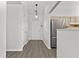 Welcoming foyer area with durable floors, fresh paint, and easy access to the kitchen and main living spaces at 1222 W Wylie Bridge Rd, Woodstock, GA 30188