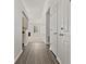 Light and bright hallway featuring new floors, fresh paint, and easy access to the living areas at 1222 W Wylie Bridge Rd, Woodstock, GA 30188