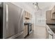 Kitchen featuring stainless steel refrigerator and gas range at 1222 W Wylie Bridge Rd, Woodstock, GA 30188