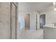Bright bathroom features tiled floor, glass enclosed shower, and separate toilet room at 128 Felicity Pike, Locust Grove, GA 30248