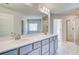 Bright bathroom with double vanity, and glass enclosed shower with marble tile at 128 Felicity Pike, Locust Grove, GA 30248