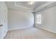 This bedroom features neutral carpet, a window with natural light, and white trim at 128 Felicity Pike, Locust Grove, GA 30248