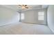 Spacious bedroom with two windows, ceiling fan and tray ceiling offers plenty of light at 128 Felicity Pike, Locust Grove, GA 30248