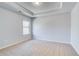 Neutral bedroom with light colored walls, carpet, white trim, and a single window at 128 Felicity Pike, Locust Grove, GA 30248