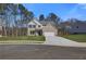 Charming two-story brick home with a well-manicured lawn and attached two-car garage at 128 Felicity Pike, Locust Grove, GA 30248