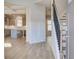 Inviting foyer with hardwood floors, staircase, and open view into the dining area and kitchen at 128 Felicity Pike, Locust Grove, GA 30248