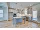This open concept kitchen features gray cabinets, stainless steel appliances and a large island at 128 Felicity Pike, Locust Grove, GA 30248