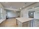 Open concept living room with coffered ceilings and plenty of natural light at 128 Felicity Pike, Locust Grove, GA 30248