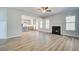 Open floor plan features a fireplace and connects to the kitchen with a large island at 128 Felicity Pike, Locust Grove, GA 30248