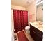 Cozy bathroom with a shower and a dark wood vanity at 2269 Reddy Farm Ln, Grayson, GA 30017