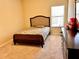 Bedroom with carpeted floors, dresser, and a window bringing in natural light at 2269 Reddy Farm Ln, Grayson, GA 30017