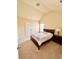 Bedroom featuring carpet flooring, a double door closet, and a window at 2269 Reddy Farm Ln, Grayson, GA 30017